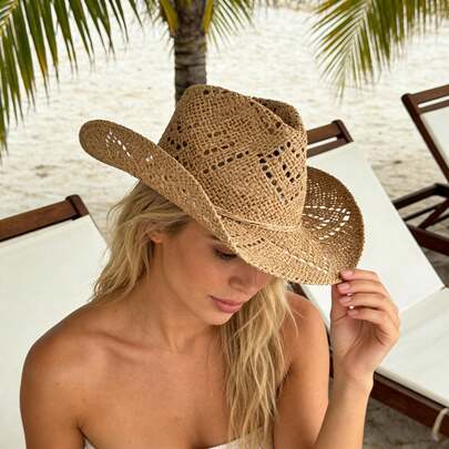 Hollow Western Cowboy Hat Combines Straw Material With Retro Design. It Has A Wide Brim And A Classic Hat Shape. It Has Both Sun Protection And Style. It Is Suitable For Summer Travel, Beach Parties Or Theme Activities, Showing The Free And Unrestrained Western Style And Personality Declaration.