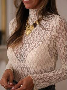 这款女士蕾丝衬衫专为四季穿着而设计，百搭实用，是春、夏、秋季的理想之选。优雅的廓形、略带性感的薄纱质感以及弹力蕾丝面料，使其成为日常出行、浪漫约会和休闲聚会的完美伴侣。这款女士蕾丝衬衫完美融合了优雅与性感，是您衣橱中不可或缺的时尚单品。 - 米色 - 查看 11