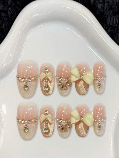 10片裸粉色牛奶黄蝴蝶结甜美亚克力美甲贴片，裸粉色渐变金色闪粉底，带蝴蝶结和钻石装饰，法式美甲贴片，短/长椭圆形假指甲，DIY美甲用品，可重复使用，附赠果冻胶和指甲锉，适合日常佩戴，情人节适用。