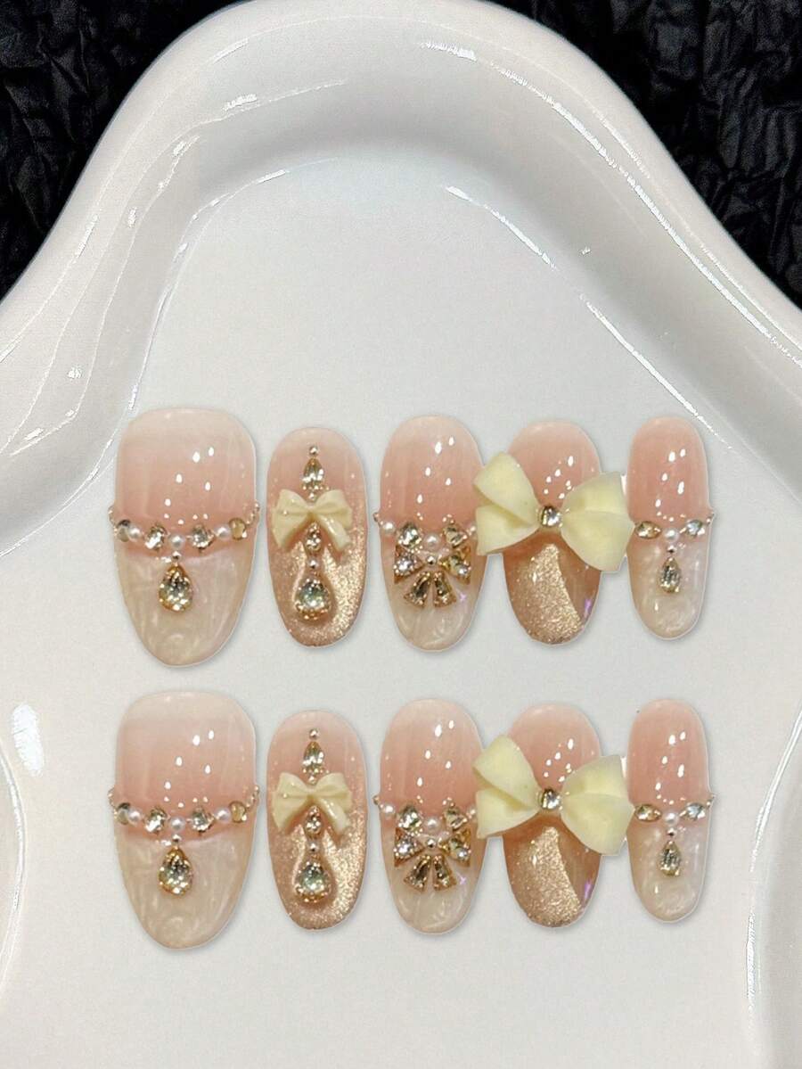 10 Stück nude rosa & milchig gelbe Schleifen Acryl Fake Nägel, nude rosa Farbverlauf Gold Glitzer Schmetterling Nail Art Aufkleber, kurze/lange ovale Kunstnägel, DIY Maniküre Zubehör, wiederverwendbar, inklusive Gelee Gel und Nagelfeile, geeignet für den täglichen Gebrauch, Valentinstag - Verschiedenfarbig - Übersicht 1
