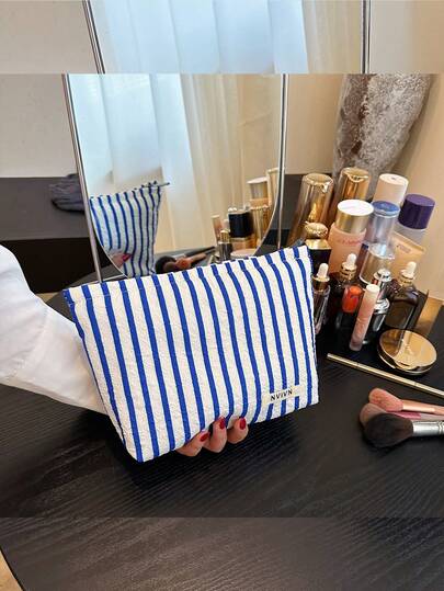 蓝色条纹泡泡纹理化妆包，便携式化妆工具收纳袋