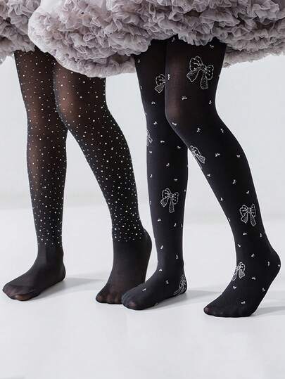 1件儿童黑色连裤袜，饰有可爱的银色蝴蝶结，时尚百搭的弹力紧身透明长筒袜，适合返校、休闲、居家、校园活动、生日派对、情人节等场合。