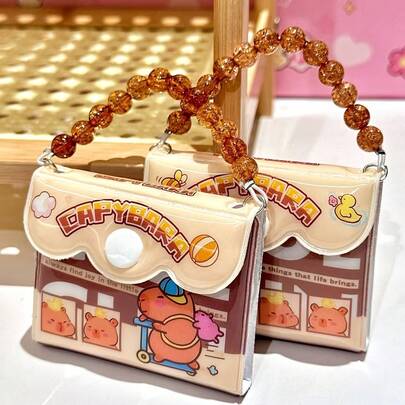 1 szt. Mini notes kieszonkowy Capybara – przenośny, z łańcuszkiem koralikowym, z zabawnym, kreskówkowym wzorem, uroczy notes podróżny do codziennych notatek