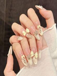 10 Stück nude rosa & milchig gelbe Schleifen Acryl Fake Nägel, nude rosa Farbverlauf Gold Glitzer Schmetterling Nail Art Aufkleber, kurze/lange ovale Kunstnägel, DIY Maniküre Zubehör, wiederverwendbar, inklusive Gelee Gel und Nagelfeile, geeignet für den täglichen Gebrauch, Valentinstag - Verschiedenfarbig - Übersicht 4