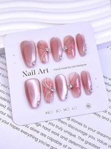 10片中号椭圆形假指甲，柔和的粉色珠光色调，3D裂纹纹理，点缀水钻，打造温柔梦幻的风格。100%纯手工制作，按压式亚克力指甲，可重复使用。套装包含1片果冻胶、1根胶棒和1把指甲锉，适合女性日常或派对佩戴。 - 彩色 - 查看 9