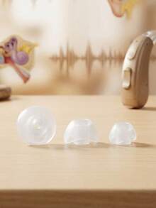 Paquete de 3 olivas gomas estándar para audífonos y aparatos auditivos diseñadas para ofrecer un ajuste cómodo y estable en el oído ideales como repuesto o reemplazo ayudan a mejorar la calidad del sonido y la experiencia de escucha fabricadas con material suave flexible e hipoalergénico fáciles de colocar compatibles con distintos modelos de auxiliares auditivos tamaño estándar para uso diario esenciales para el mantenimiento correcto y prolongar la vida útil del dispositivo - Transparentes - Ver 1
