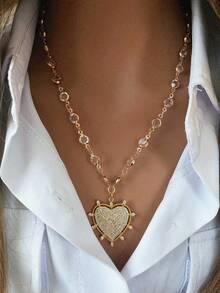 一条心形扣项链，配心形吊坠，设计大胆。另有一条珍珠链项链，配心形吊坠，优雅时尚，适合作为礼物。 - 金色 - 查看 4