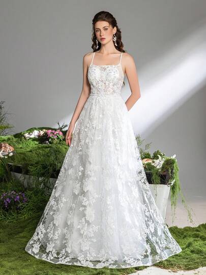 Faeriesty Elegant White Spaghetti Strap Maxi Party Gown For Women | Embroidered Mesh Fabric With Voluminous Drape & Sheer Beauty, 3D Appliques Detailing For Romantic Dimension, Back Cross-Binding Strap Accent For Sexy Elegance, For Spring Weddings, Garden Parties, Formal Galas