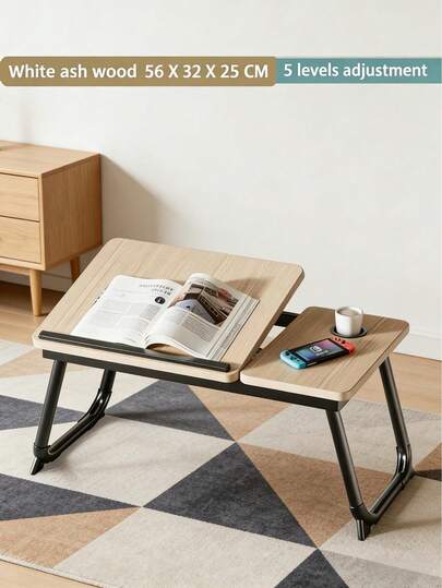 Un bureau d'ordinateur pliable en bois, portable et doté de 5 angles d'inclinaison et d'un porte-gobelet. Dimensions : 55 x 32 x 25 cm. Idéal pour travailler ou étudier au lit, avec un ordinateur portable, au sol, en prenant son petit-déjeuner au lit, ou encore en lisant, travaillant ou étudiant sur un canapé ou un banc. Un cadeau parfait pour un ami.