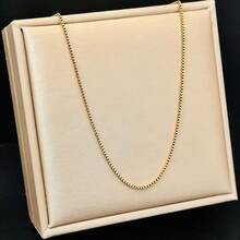 1条18K镀金钛钢项链，链子造型包括十字架、刀、蛇骨、O形、盒子、嘴唇、锤子、星星等，长度45+5厘米。 - 金色 - 查看 16