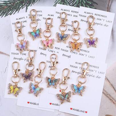 30件套婴儿派对礼物，适合送给客人，也可作为婴儿派对回礼或儿童派对礼物。白色雏菊爱心钥匙扣套装，包含10个钥匙扣、10张感谢卡和10个欧根纱袋。此款钥匙扣包带套装适合送给老师、教练、导师、家长和朋友。| Time Additions，理想礼物