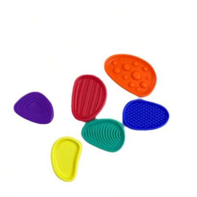 6颗感官舒缓石，柔软硅胶材质，表面纹理，适合办公桌减压、缓解焦虑，也可作为生日派对礼物。