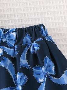 Conjunto de 2 piezas de camiseta de manga corta con cuello redondo y decoración de lazo azul, y falda mini elegante para niñas, de moda para uso al aire estilo escolar, verano - Azul - Ver 6
