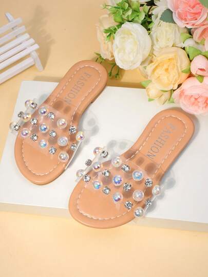 1双女童裸色透明凉鞋，饰有彩虹钻石，露趾平底，舒适闪亮，甜美飘逸，适合夏季街头穿着