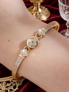 Camhanno 1 pièce - Bracelet en cuivre incrusté de fleurs en zircone. La texture complète en zircone est associée à un anneau circulaire dynamique, dégageant un sentiment de luxe et en faisant une touche de finition parfaite pour les tenues de tous les jours. - Doré - Voir 6