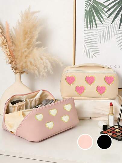 心形化妆包，一款时尚的心形女士化妆包，便携式旅行收纳包，可存放化妆品、护肤品、口红和洗漱用品，也可作为卫生巾收纳包，适合旅行和日常使用，是送给女士的完美礼物，适合情人节、母亲节、感恩节等节日。