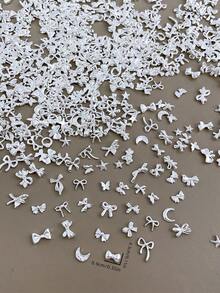 Bộ 50/100 món trang trí móng tay mini, bao gồm các mặt dây chuyền hình trăng khuyết, nơ, sao, thánh giá màu bạc, phong cách tối giản Y2K bằng kim loại, phù hợp cho nhiều mục đích tự làm phụ kiện nghệ thuật móng tay. - Nhiều màu - Xem 5