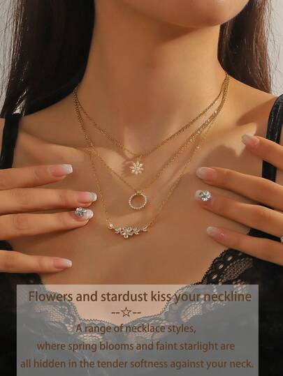 1件花卉星形吊坠项链，饰有花朵、圆圈和花簇设计，并镶嵌精致的锆石，优雅百搭，适合通勤和约会佩戴，是送给女友或闺蜜的贴心礼物。