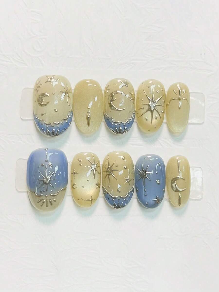 10片纯手工制作的短款椭圆形美甲贴片，金色梦幻空灵风格，金色猫眼闪粉美甲贴片，蓝色法式渐变，饰有手绘星月图案，精致柔美，适合女性和女孩，春夏秋冬节日派对及日常生活佩戴。 - 彩色 - 查看 1