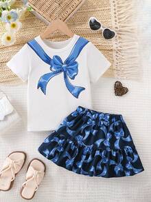 Conjunto de 2 piezas de camiseta de manga corta con cuello redondo y decoración de lazo azul, y falda mini elegante para niñas, de moda para uso al aire estilo escolar, verano - Azul - Ver 1
