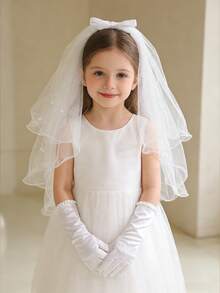 Bộ 2 món gồm khăn voan và găng tay màu trắng đính nơ và ngọc trai giả dành cho bé gái, thích hợp cho lễ rước lễ, trang phục công chúa, đám cưới, tiệc sinh nhật, lễ Phục sinh và các dịp khác. - Mạng che mặt và găng tay - Xem 3