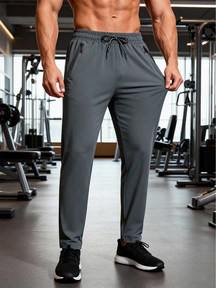 男士轻便透气运动裤，灰色，抽绳腰带，拉链口袋，舒适面料，适合夏季健身、跑步、篮球等运动。 - 灰色 - 查看 1