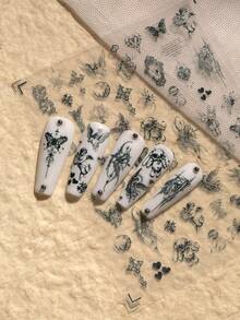 1张哥特复古主题美甲贴纸，精致神秘风格，包含天使、十字架、蝴蝶、心形、月亮、花朵、复古边框、藤蔓、细线条等元素，充满暗黑神秘的美感，适合DIY美甲和装饰，尤其适合喜欢暗黑、哥特、复古小众风格美甲的人士。 - 黑色 - 查看 5