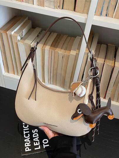 This Versatile Crescent-Shaped Bag Is A Stylish And Simple Women's Handbag Made Of Pebbled Leather. It's A Shoulder Bag With A Zipper Closure And Decorative Charm. Suitable For Daily Commutes, Shopping, Outings, As A Gift, Or For Dates.