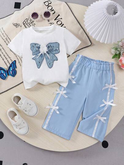 女婴水洗蓝蝴蝶亮片刺绣针织圆领运动时尚T恤和蝴蝶结装饰休闲裤套装，适合户外活动或日常休闲穿着。