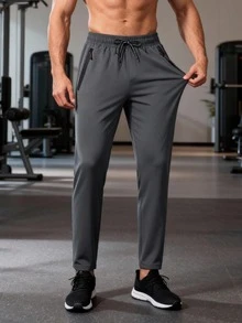 男士轻便透气运动裤，灰色，抽绳腰带，拉链口袋，舒适面料，适合夏季健身、跑步、篮球等运动。 - 灰色 - 查看 2