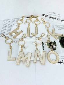 1pc 26 English Alphabet Faux Pearl Alloy Keychain Paired With Bowknot Ornaments, Popular Accessory, Backpack Charm Car Hanging Pendant Women Girls,Wallet And Handbag Accessories,Couple Pendant, Bag Pendant, Headphone Pendant,Suitable As A Family, Friends, Lovers, Mother's Day Gifts, Teacher Gifts, Birthday Gifts, Holiday Gifts - 金色 - 查看 6