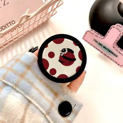 A Unisex, Stylish, Retractable, Foldable, And Magnetically Attached Phone Case Stand Adorned With A Korean-Style Polka Dot Snake Design. A Vibrant Phone Accessory, A Must-Have For Desktop Viewing And Binge-Watching, Available Locally.