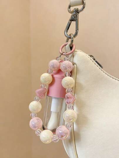 可爱绿色圆形皮革迷你零钱包兼钥匙扣 - 多功能收纳包，饰有小眼睛图案。配有多功能手机隔层、黑色腕带、通用手机挂绳孔和防丢夹。| 适合存放钥匙、硬币、银行卡和耳机。