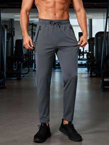 男士轻便透气运动裤，灰色，抽绳腰带，拉链口袋，舒适面料，适合夏季健身、跑步、篮球等运动。 - 灰色 - 查看 3