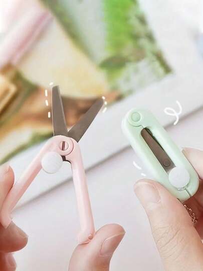 1把创意迷你便携折叠剪刀 - 不锈钢材质，小巧易用，适用于裁剪粉色纸张、美术工艺品、办公及学习用品，设计新颖，金属结构