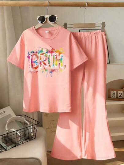 This Casual Set Features A Unique Letter Print Design, Specially Designed For Young Ladies. The Set Includes A Pink Short Sleeve Round Neck T-Shirt And A Flared Pants.