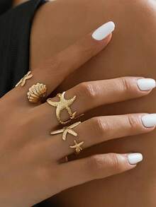 Set de 3 anillos abiertos minimalistas personalizados con estrella de mar y concha, adecuado para mujeres en vacaciones de verano en la playa y para usar en capas - Dorado - Ver 4