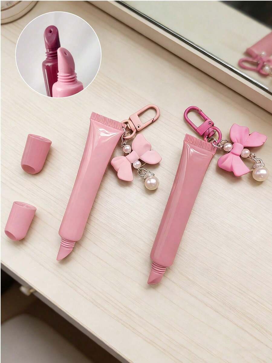 Lippenglossspender mit Schlüsselanhänger Fliege mit Perlenanhänger, nachfüllbarer Lippenglossspender, leere Puder Foundation Concealer Verpackung, weiche Lippenglosstube zum Zusammendrücken, multifunktionaler Lippenstift Nachfüllbehälter, zusammendrückbare weiche Tube, Must-Have für Modebewusste, einzigartiges Geschenk für Freundin, Geliebte, Braut, Brautjungfer, Familie, geeignet für Reisen, Valentinstag & Festtagsgeschenke - Verschiedenfarbig - Übersicht 1