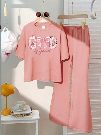 This Casual Set Features A Unique Pink Bow Print Design, Specially Crafted For Young Ladies. The Set Includes A Pink Short Sleeve Round Neck T-Shirt And A Flare Leg Pant.