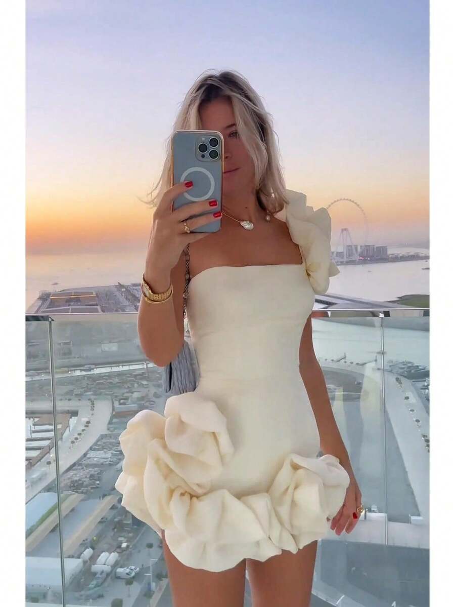 A Short, Fitted Dress With Irregular Ruffles And A Cinched Waist. - White - View 1
