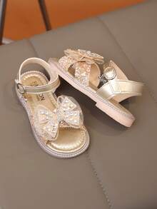 زوج جديد من الصنادل المسطحة الأنيقة للبنات، مزينة بالخرز واللؤلؤ والفصوص على شكل فيونكة، أصابع مستديرة، مناسبة للارتداء اليومي والرقص والخروج في الربيع والخريف، مزينة بترتر، أحذية أميرة مغلقة الأصابع - الذهبي - مشاهدة 3