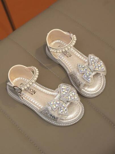 1 par de nuevas sandalias planas para niñas con moño, sandalias de princesa brillantes, resistentes al desgaste, antideslizantes y suaves, adecuadas para uso diario, casual y de fiesta