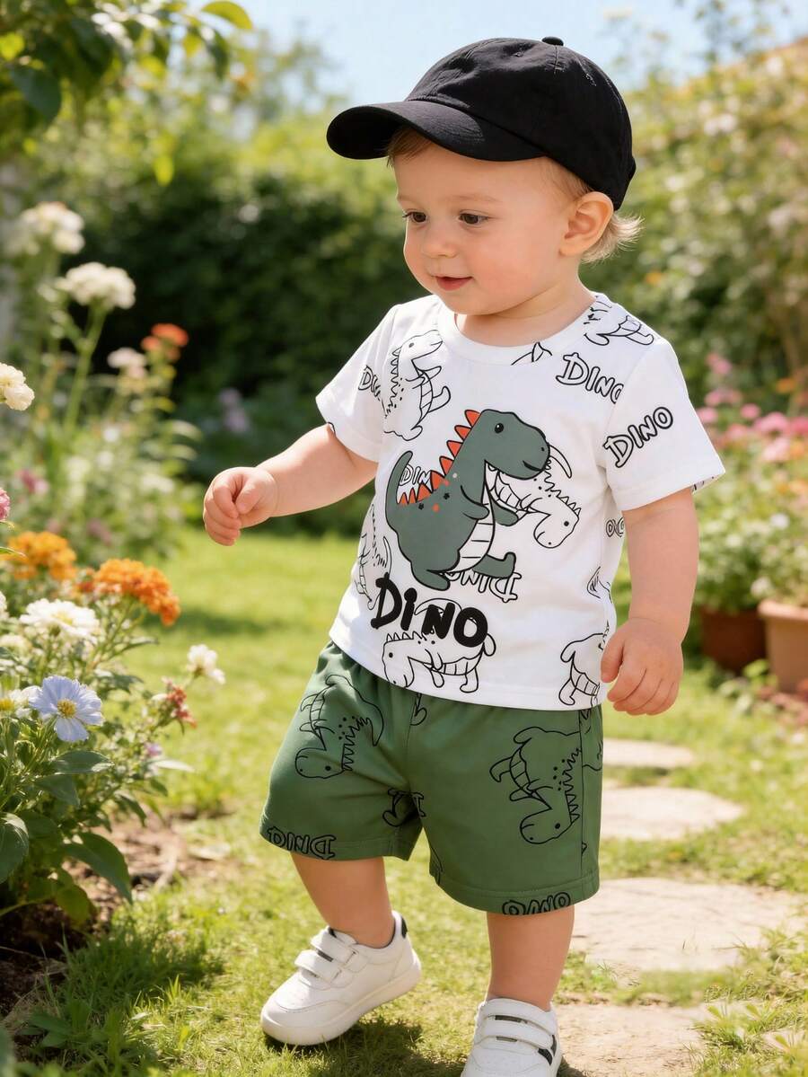 Set de 2 piezas Conjunto informal de ropa exterior para bebés recién nacidos niños, camiseta blanca de cuello redondo con estampado de letra "DINO" de dinosaurio lindo y deportivo, y pantalones cortos verdes de cintura elástica, primavera/verano
