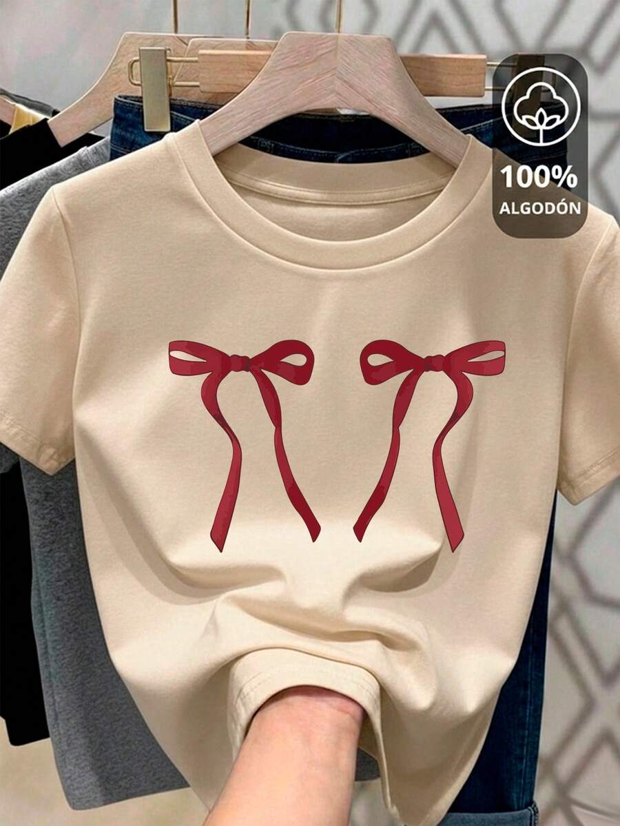 Camiseta para mujer con corte Oversize 100% algodón con cuello redondo y manga corta con diseño cute de moños Playera cómoda y suave - Hueso - Ver 1