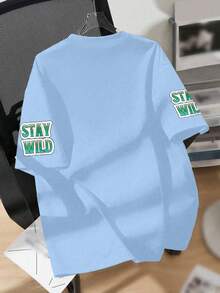 T-shirt oversize graphique pour adolescent garçon, imprimé dégradé "DREAMLAND", design coucher de soleil désertique tropical et palmier, accent de manche "STAY WILD", coupe ample et décontractée. Pour la rentrée scolaire, les sorties en plein air, les loisirs quotidiens, les tenues d'été - Bleu ciel - Voir 2