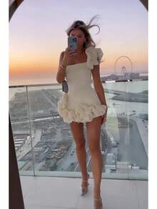 A Short, Fitted Dress With Irregular Ruffles And A Cinched Waist. - White - View 7