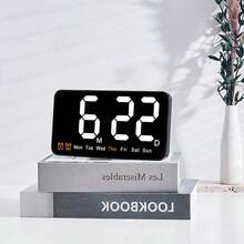 Chiếc đồng hồ treo tường mới này có thiết kế tối giản với màn hình lớn, phù hợp để sử dụng làm đồng hồ treo tường hoặc đồng hồ để bàn. Đây là một chiếc đồng hồ đa chức năng có thể sử dụng trong phòng khách, với các chức năng như độ ẩm, báo thức, ngày tháng và nhiệt độ, đáp ứng nhiều nhu cầu khác nhau. - 1 chiếc (không kèm pin) - Xem 3