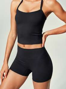 UONNOU Bộ đồ thể thao nữ 2 món gồm áo hai dây và quần short, đồ tập thể dục, đồ tập yoga, bộ đồ bó sát tập luyện, nâng mông, kiểm soát eo, làm thon gọn chân, dây chéo, hở lưng và vai gợi cảm, mút ngực có thể tháo rời, áo siêu ngắn, chất liệu mềm mại và thoải mái, phù hợp cho thể thao, hoạt động ngoài trời, phòng tập, yoga, pilates, các bài tập nhẹ, tập luyện, chạy bộ, mặc hàng ngày, đi làm, bộ đồ thể thao thời trang. - màu đen - Xem 3