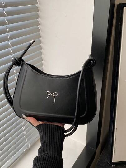 2026秋季新款极简主义蝴蝶结装饰设计休闲大容量女士单肩包