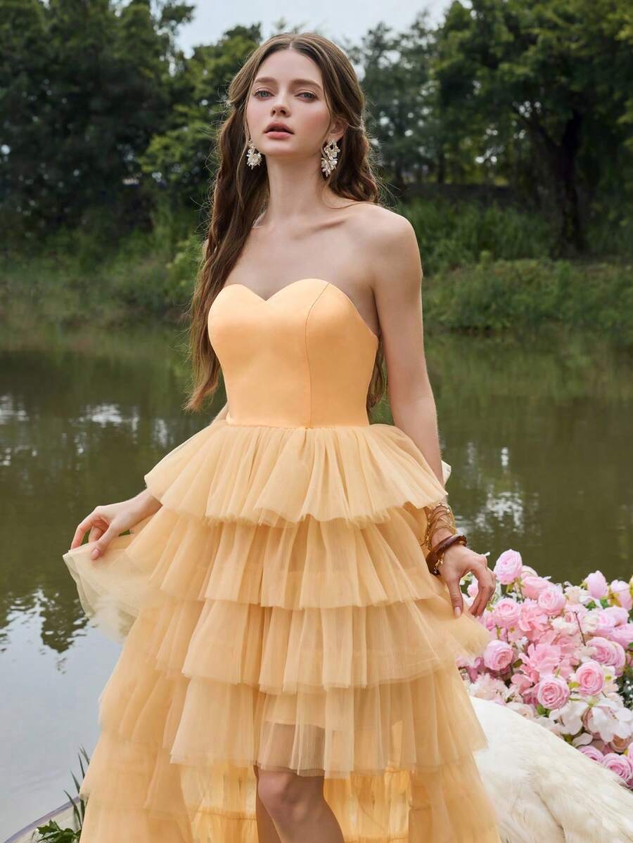 Faeriesty Đầm dạ hội cúp ngực thanh lịch với phần thân áo xếp ly, chân váy xếp tầng bằng vải tuyn mềm mại, thiết kế tinh tế, thích hợp cho các buổi tiệc tối trang trọng, trang phục dự đám cưới, chụp ảnh cưới, sự kiện thảm đỏ, các buổi dạ tiệc sang trọng và tiệc mùa xuân. - Màu Cam san hô - Xem 1